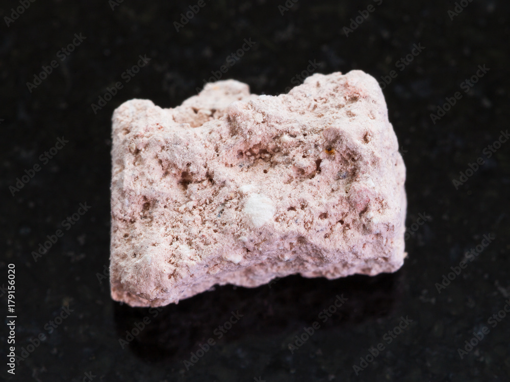 rough Kaolinite stone on dark background rough Kaolinite stone on dark background