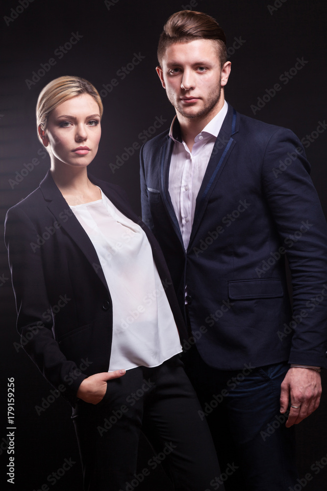 Picture of attractive couple of office workers standing Picture of attractive couple of office workers standing