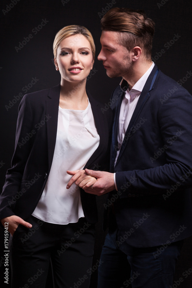 Picture of attractive couple of office workers standing Picture of attractive couple of office workers standing