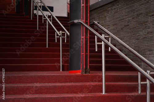 Red carpet on stairs of building, outdoors © Africa Studio