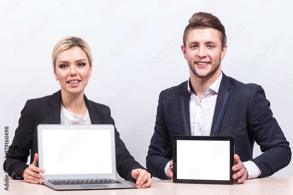 Picture of team of office workers both holding tablet Picture of team of office workers both holding tablet