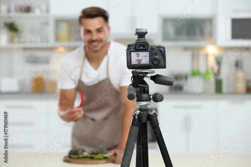 Young blogger recording vid...