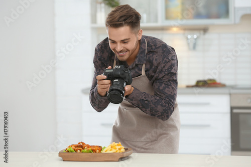 Young blogger taking photo ...