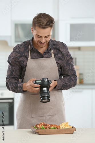 Young blogger taking photo ...
