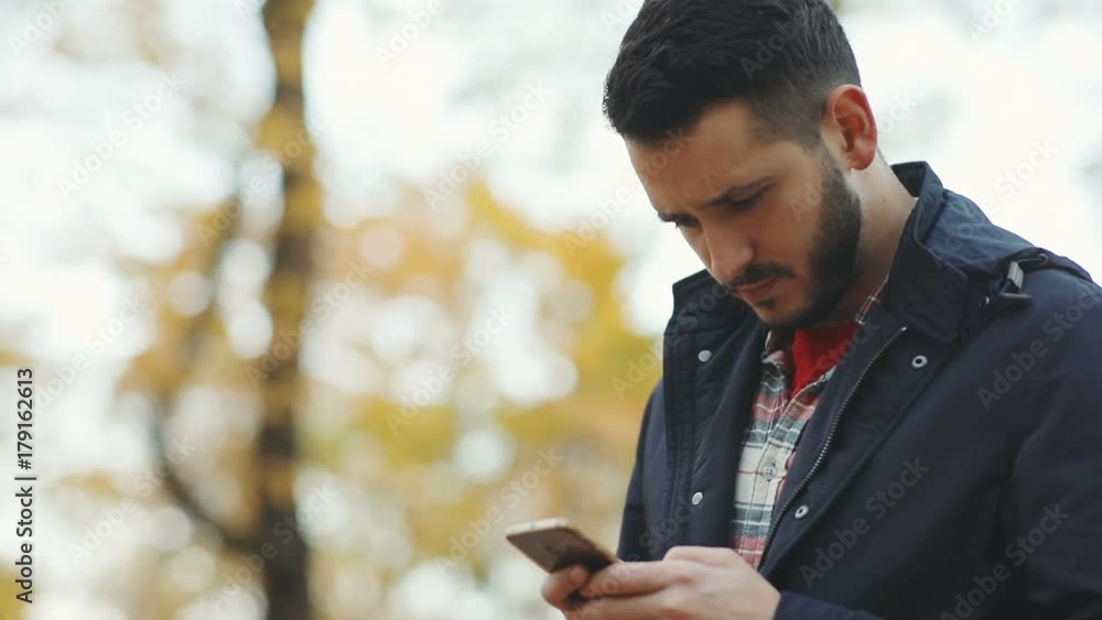 happy satisfied businessman man using smartphone outside blurred background trees autumn surprised emotional face bearded caucasian chat tapping message digital gadget tech development app store login happy satisfied businessman man using smartphone outside blurred background trees autumn surprised emotional face bearded caucasian chat tapping message digital gadget tech development app store login