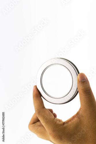 Hand's man holding transparent of metalic round lid