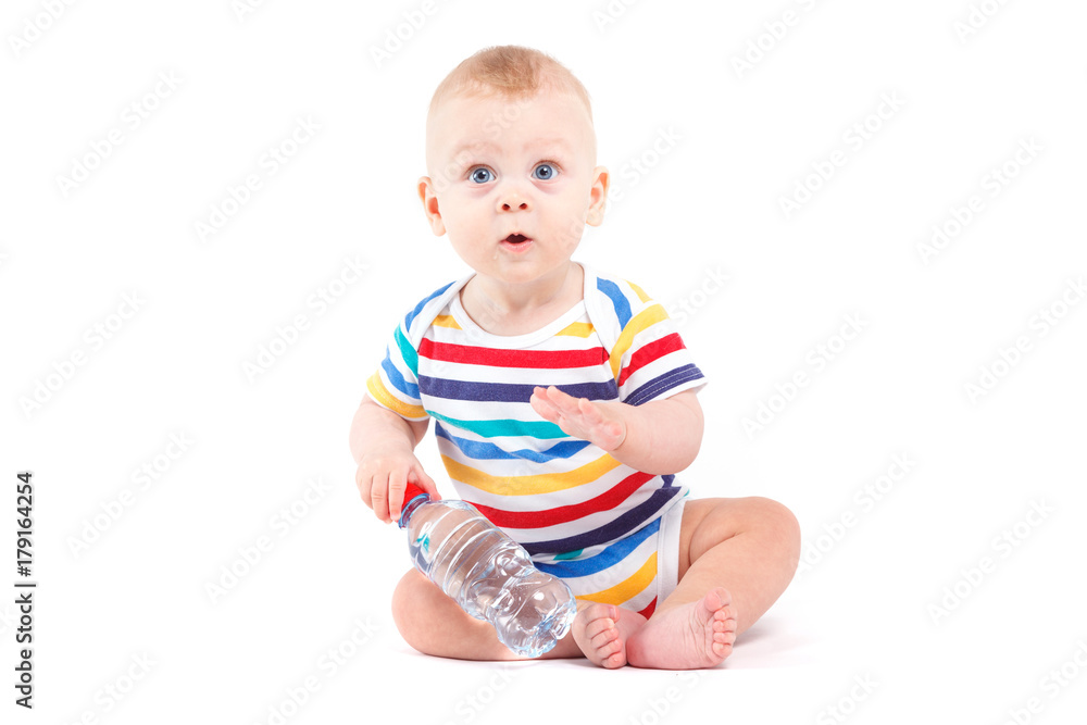 cute joyful baby boy in colorful shirt hold water bottle cute joyful baby boy in colorful shirt hold water bottle