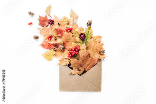 Red autumn  leaf pattern frame with minimal creative berry arrangement pattern on white background . flat lay, top view. christmas background wallpaper.