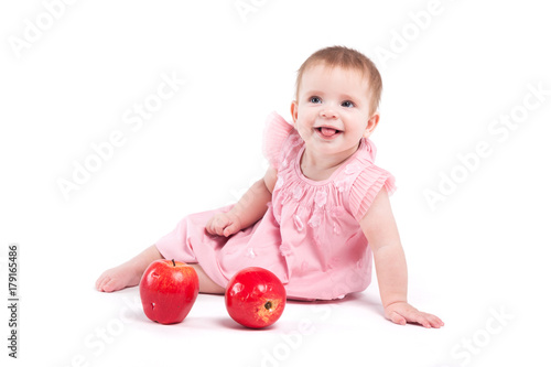cute cheerful little girl in dress with apples © Ivan Traimak