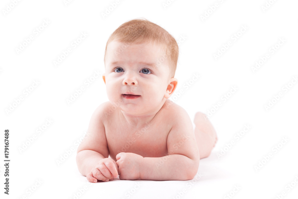 beauty little boy in white diaper lies on belly beauty little boy in white diaper lies on belly