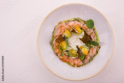 Sea tartare sauce from a langoustine, with green apple and a cucumber, is served with caviar whitefishes