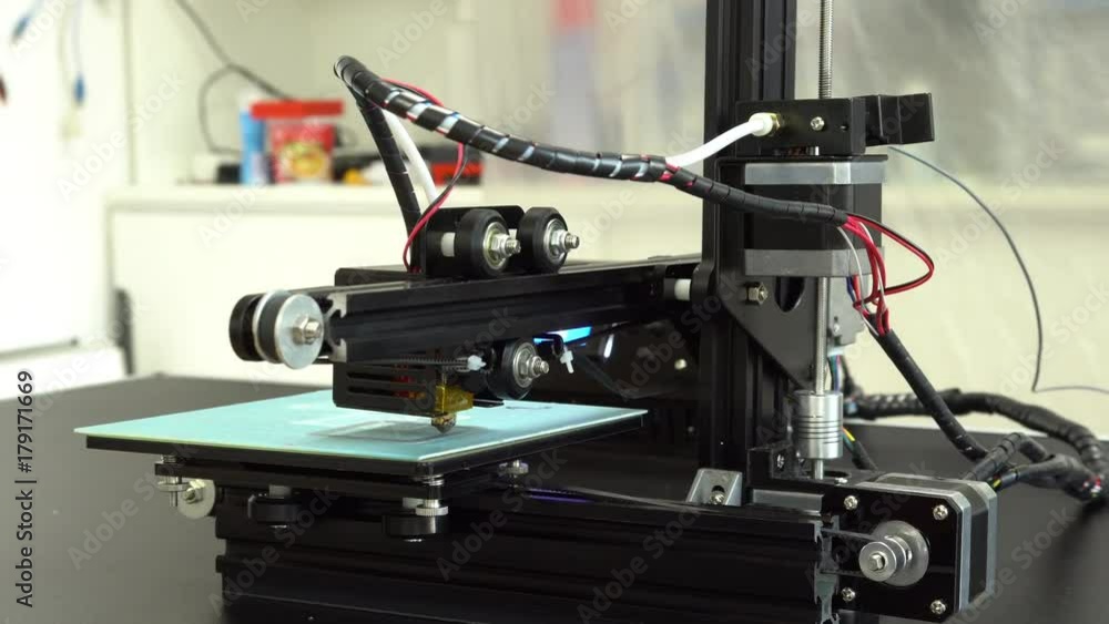Small home 3D printer prints plastic toy filament Small home 3D printer prints plastic toy filament