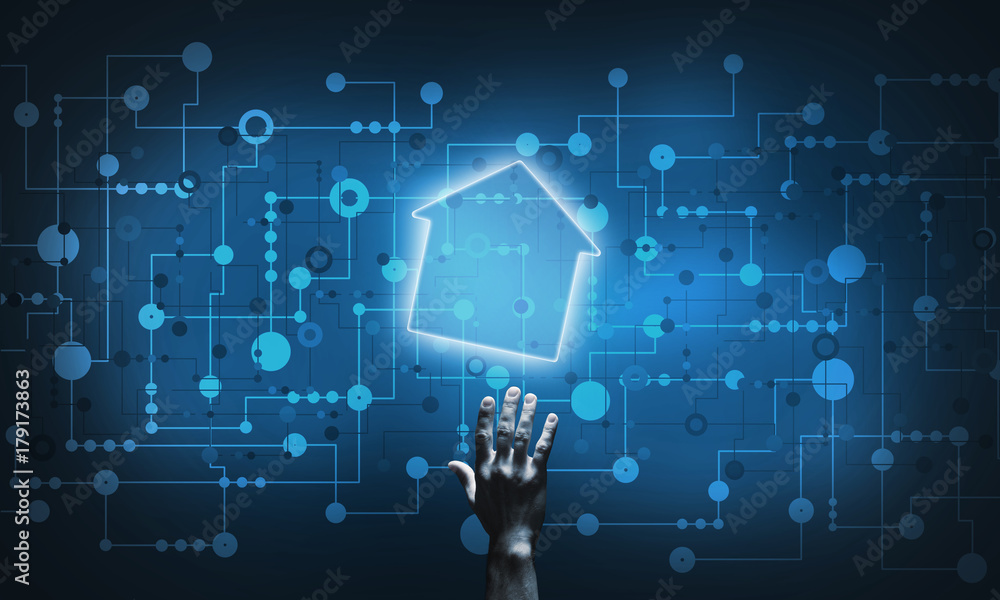 Conceptual image with hand pointing at house or main page icon on dark background Conceptual image with hand pointing at house or main page icon on dark background