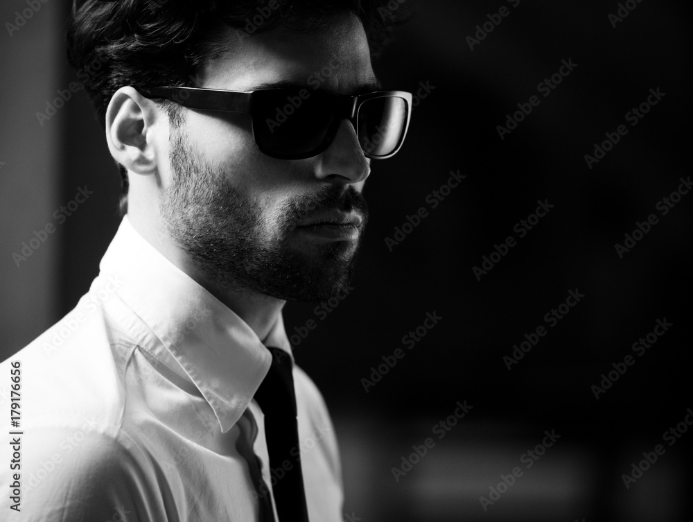 Male model posing in a dark hallway. Male model posing in a dark hallway.