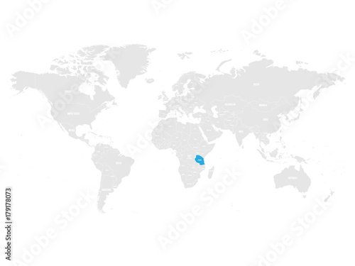 Tanzania marked by blue in grey World political map. Vector illustration.