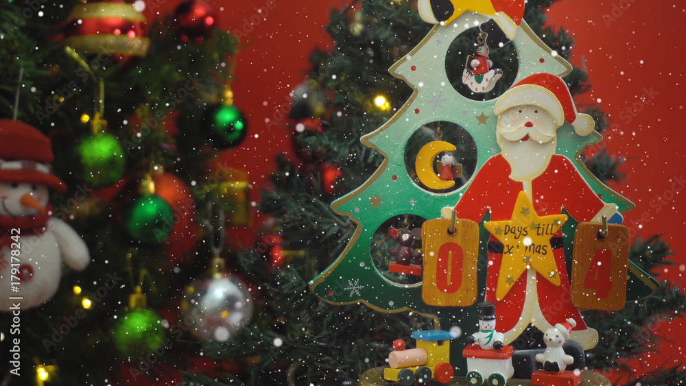 Greeting Season concept.Santa Claus show 4 days till Xmas with ornaments on a Christmas tree with decorative light