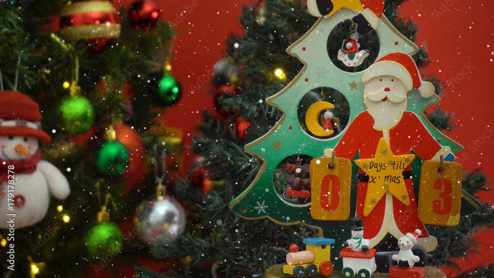Greeting Season concept. Santa Claus show 3 days till Xmas with ornaments on a Christmas tree with decorative light