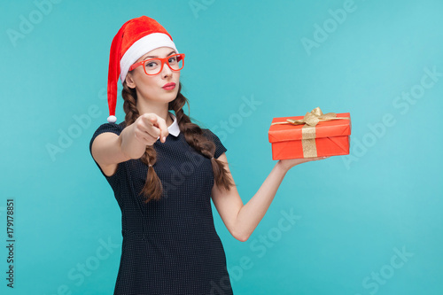 Young  woman in dark dress and glasses holding gift box