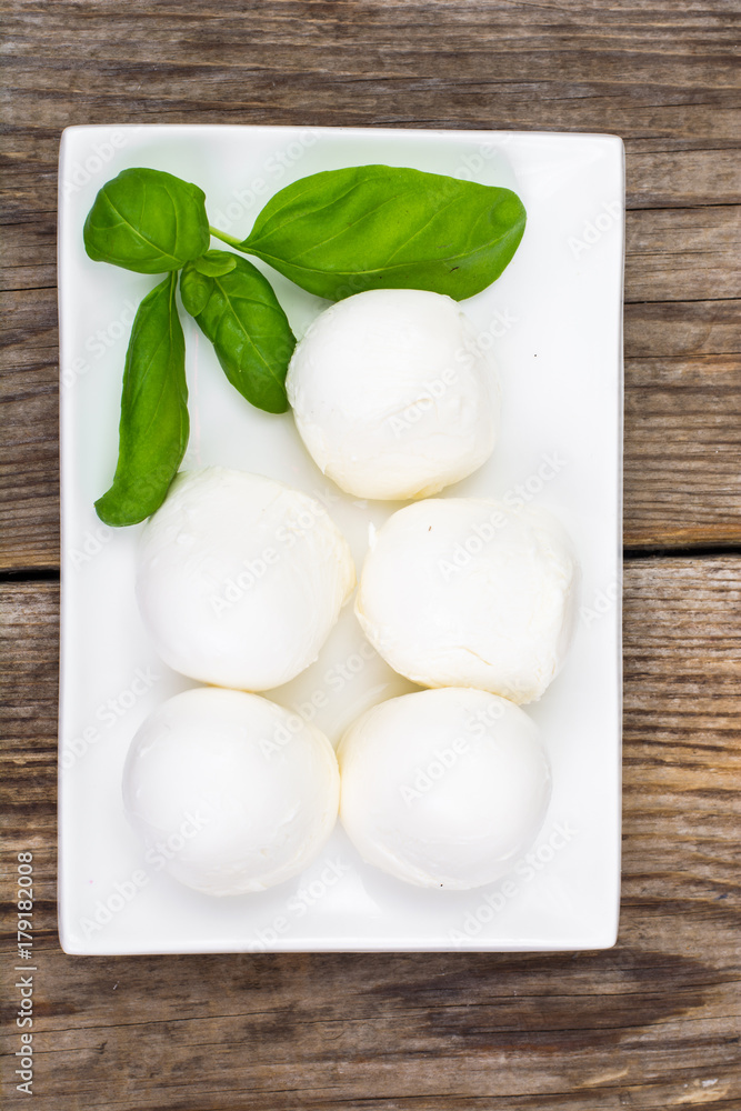 Snack on plate of mozzarella and basil Snack on plate of mozzarella and basil