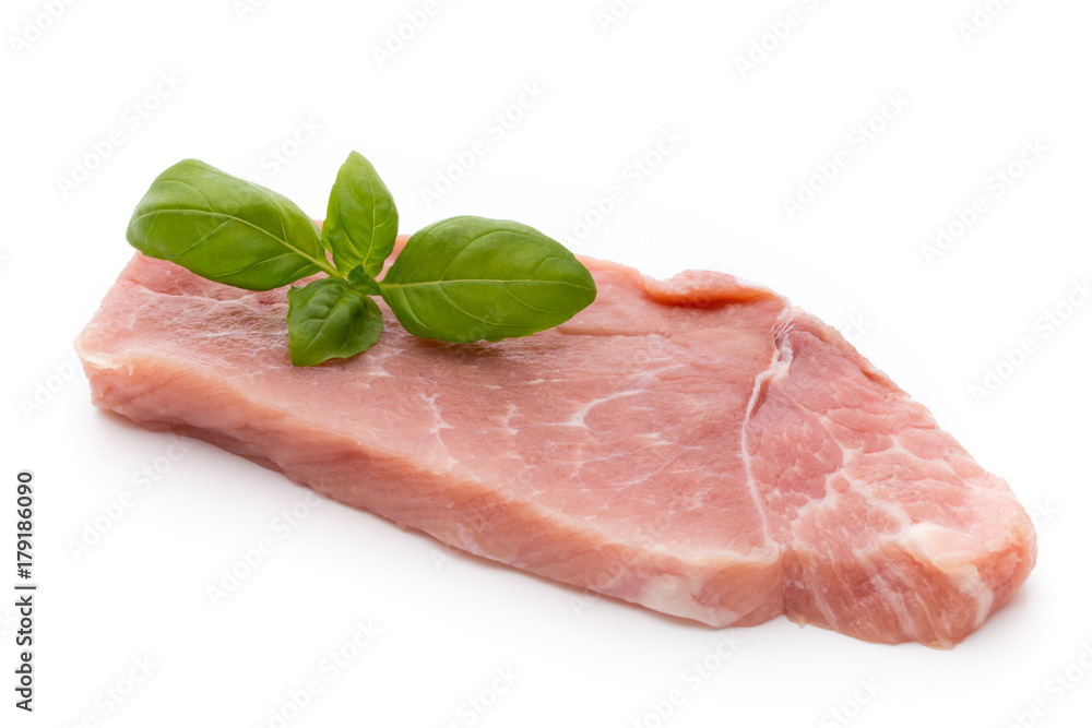 Fresh pork fillet with basil on a white background. Fresh pork fillet with basil on a white background.
