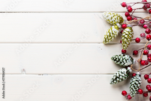 Christmas decor on the wooden white background.