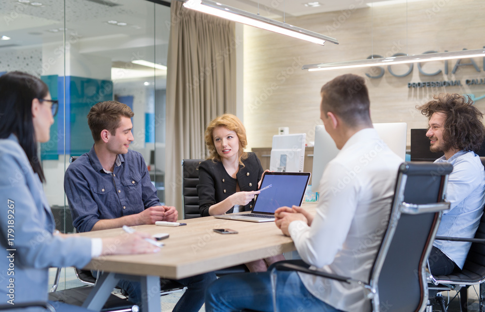 Startup Business Team At A Meeting at modern office building