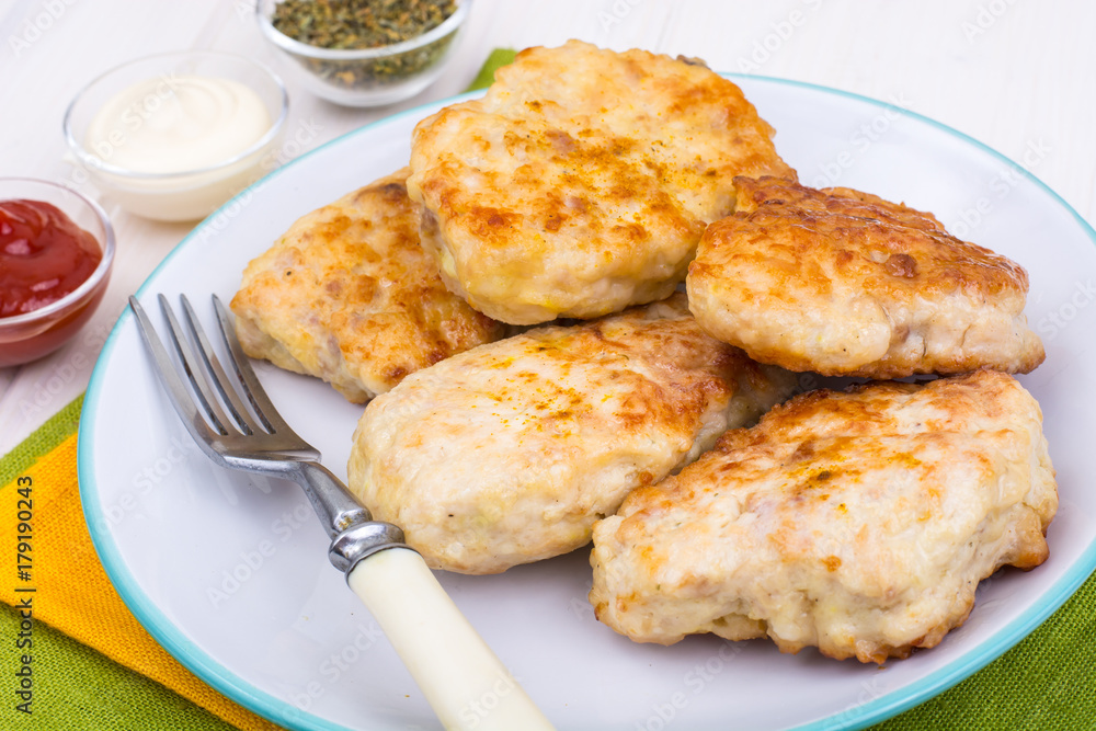 Chicken cutlets with ketchup and mayonnaise