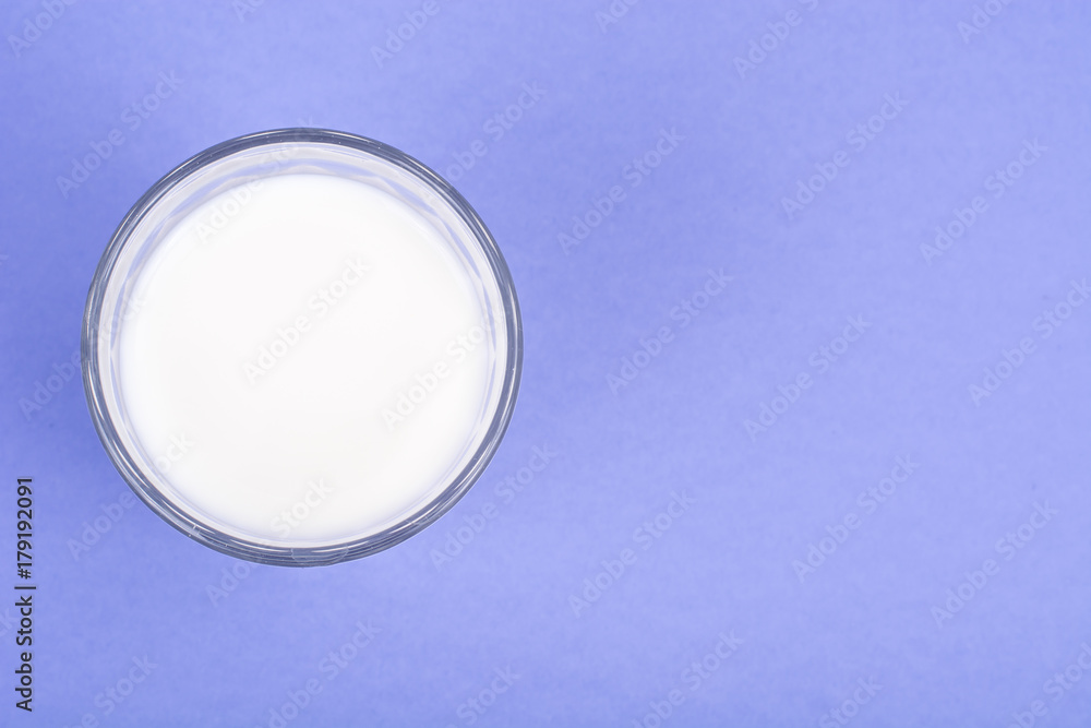 Glass with milk on bright background Glass with milk on bright background