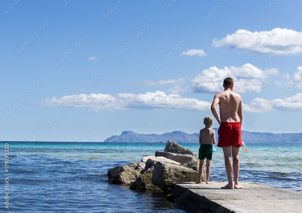 Father and son on the beach