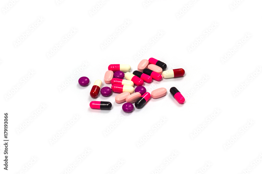 Closeup pills and capsules with isolated white backgroun Closeup pills and capsules with isolated white backgroun