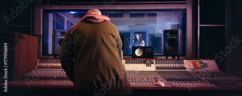 Slika na platnu Musicians producing music in professional recording studio