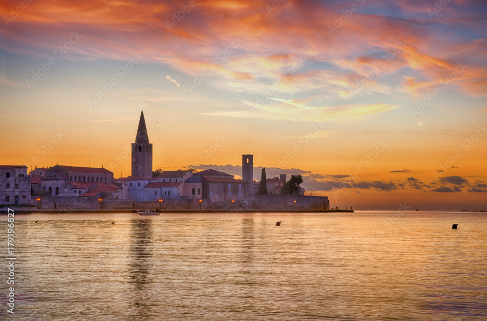 Naklejka premium Panoramic view of Porec, during sunset with cloudy sky. Croatia, Adriatic coast
