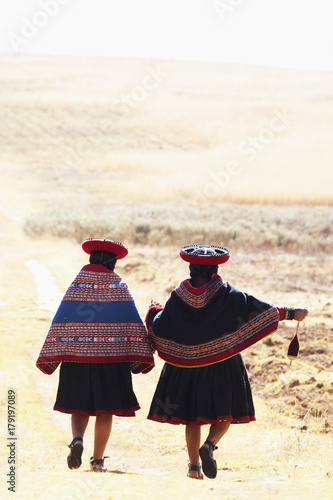 Two Quechua Indian women weaving. Cusco area. Peru photo