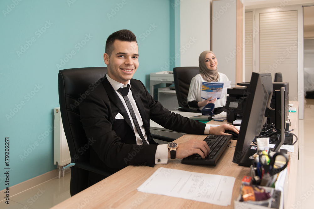 Businessman And Businesswoman Having Discussion In Office Businessman And Businesswoman Having Discussion In Office