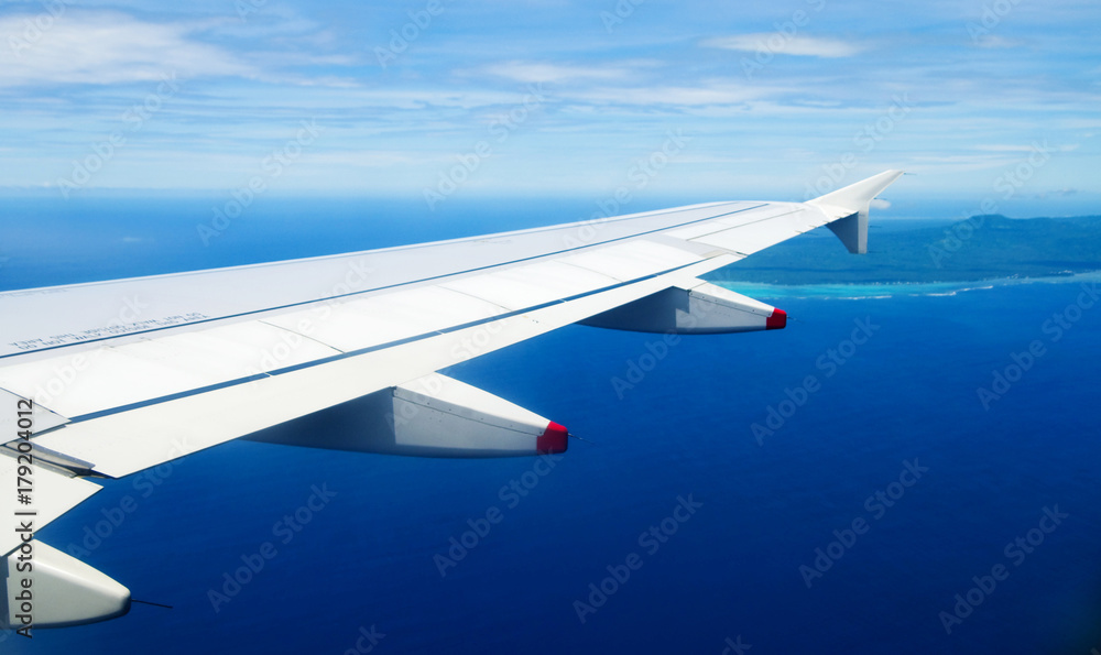 Airplane heading to an island Airplane heading to an island