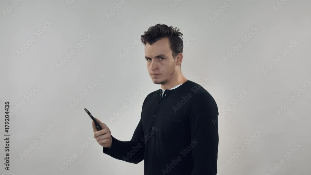 angry man has phone conversation. irritated guy screaming during negotiations angry man has phone conversation. irritated guy screaming during negotiations