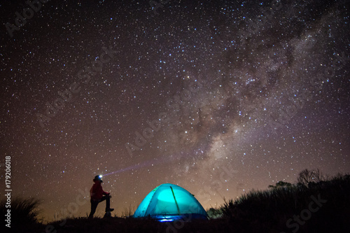 Man, tent and so many stars
