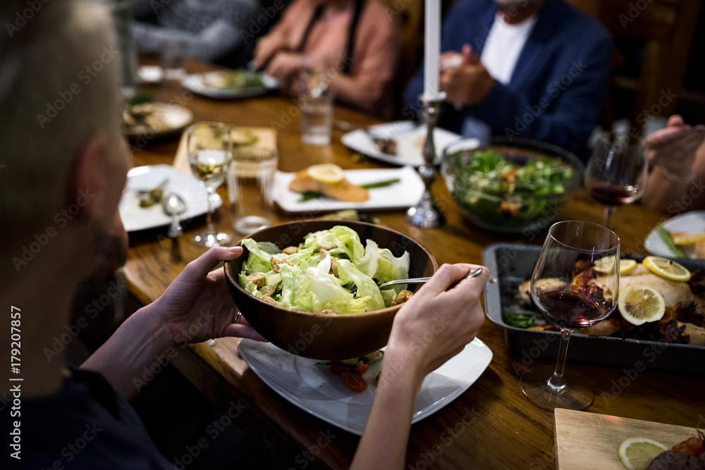 Group of diverse friends are having a dinner together Group of diverse friends are having a dinner together