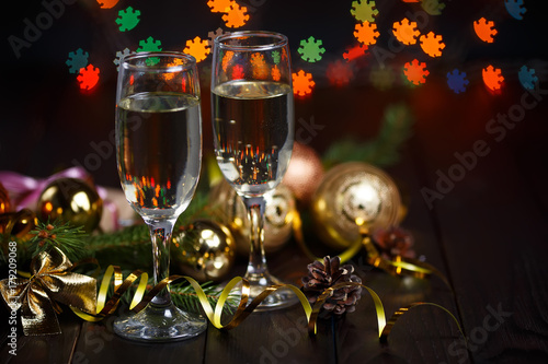 New year celebrating concept. Two glasses of champagne, fir tree