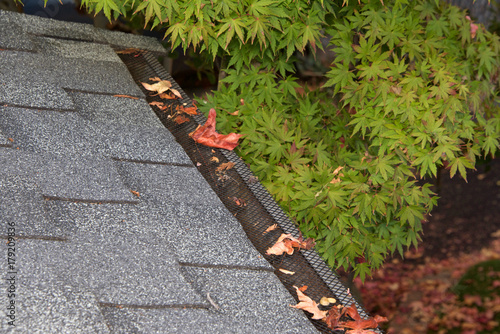 Canvas Print Mesh guards over troughs to prevent leaves and large debris from getting into gutters