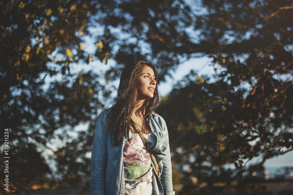 happy, thoughtful teen girl enjoying nature at sunset happy, thoughtful teen girl enjoying nature at sunset