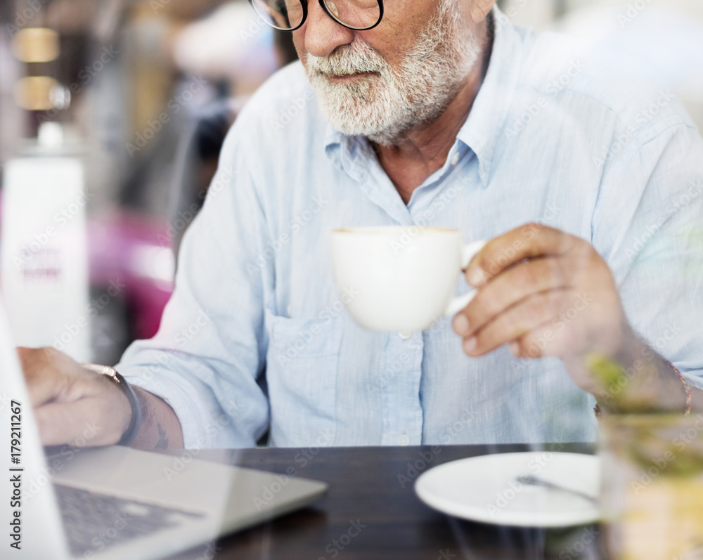 Elderly man is using computer laptop Elderly man is using computer laptop
