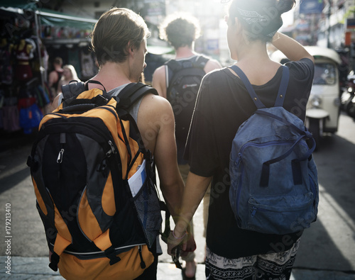 Closeup of a couple holding hands while walking