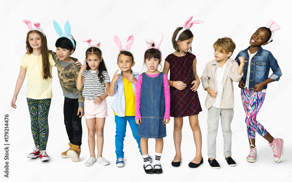 Obraz premium Group of Kids Wearing Bunny Ears for Easter Happiness Smiling on White Blackground
