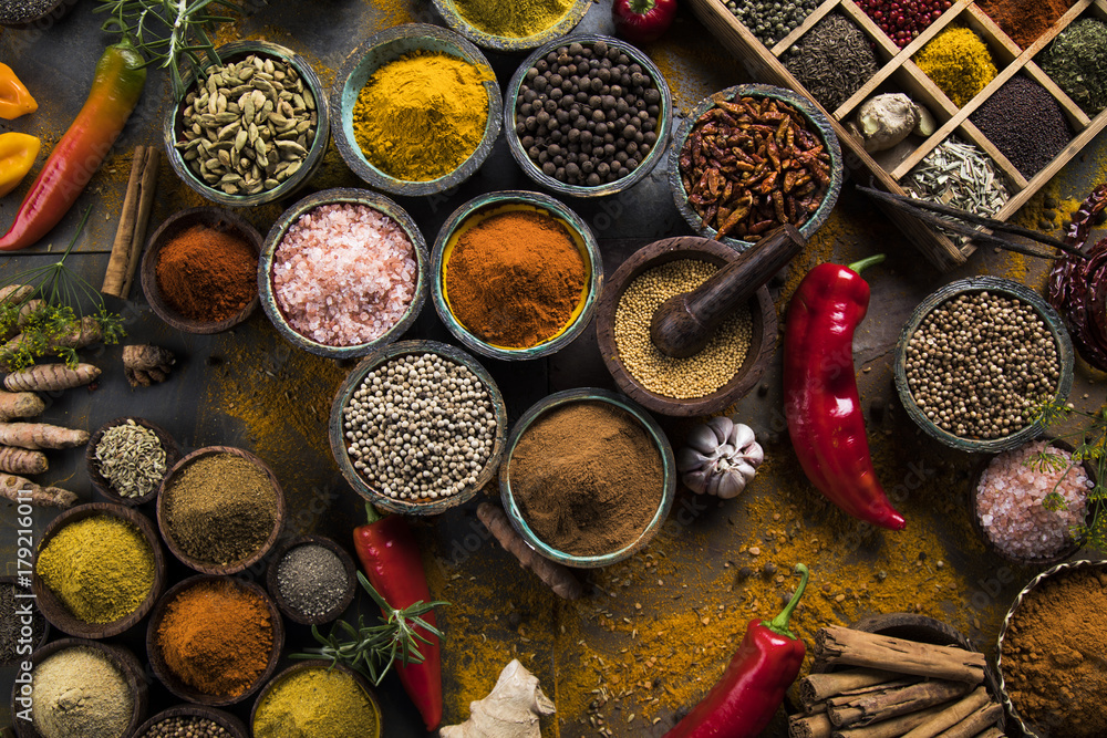 Spices and herbs in wooden bowls. Food and cuisine ingredients Spices and herbs in wooden bowls. Food and cuisine ingredients