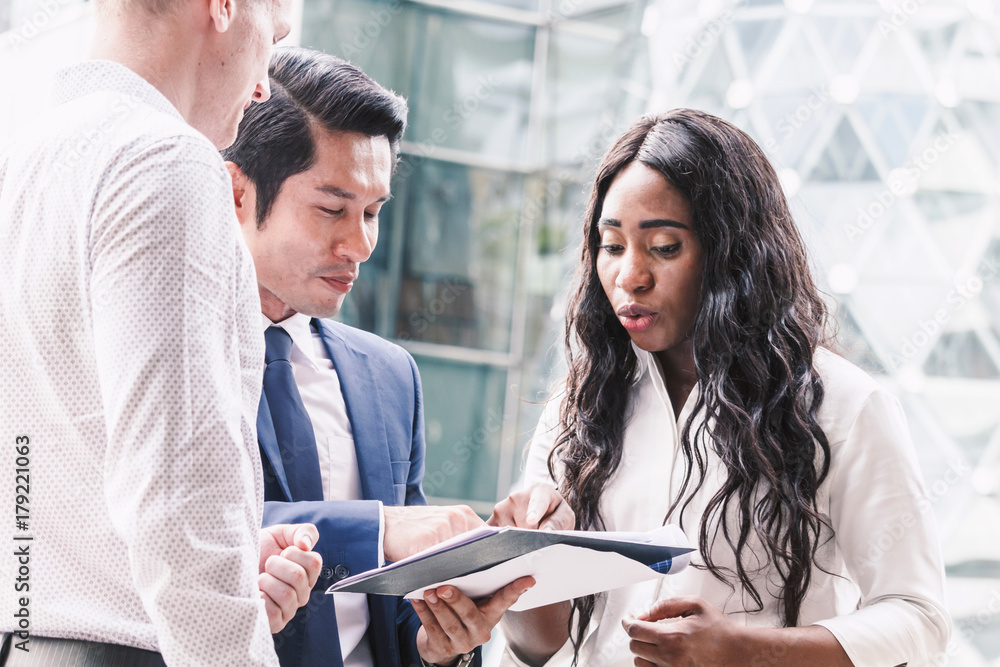 Fototapeta premium Group of business partners talking and working