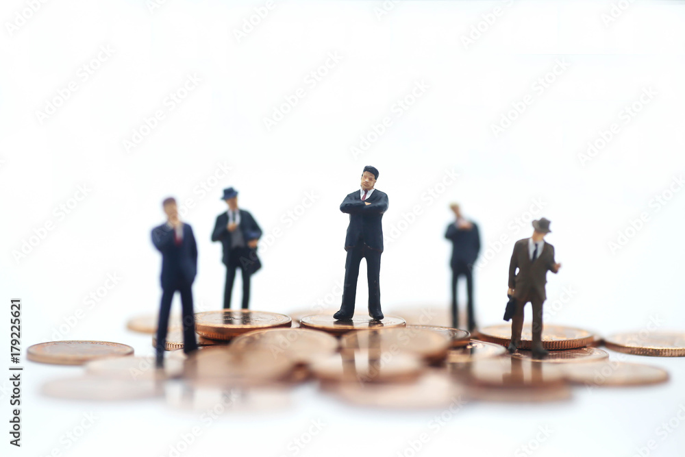 Miniature people: small figures businessmen