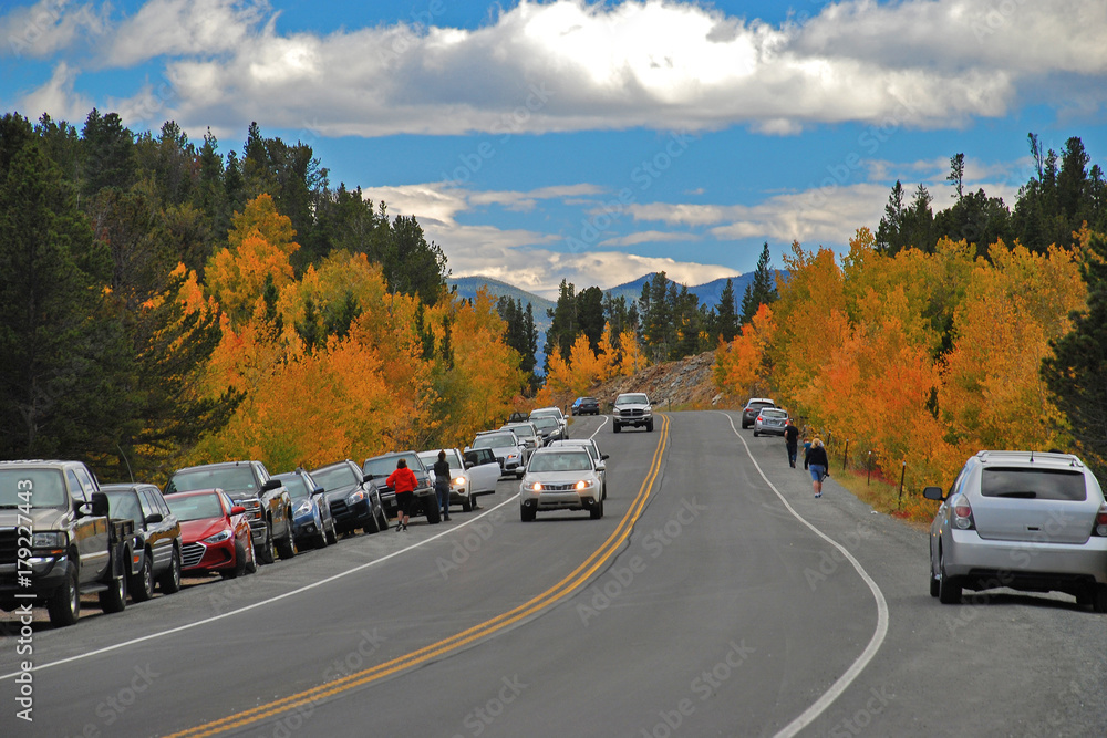 Tourists stop their cars along Colorado's Peak to Peak Highway, a Scenic Byway, to take in the Fall Colors