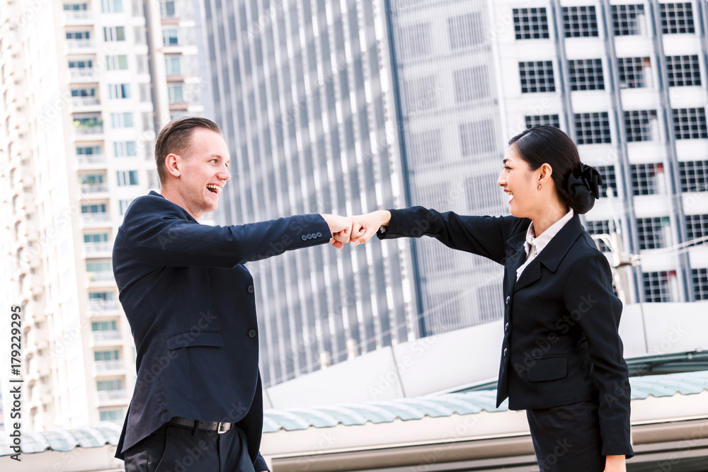 Businessman and partner giving fist bump hand Businessman and partner giving fist bump hand
