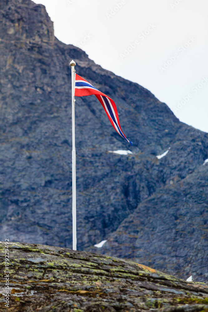 norwegian flag in rocky mountains